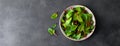 Fresh chard leaves on black background. Top view