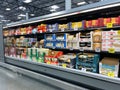 The fresh cheese aisle of a Sams Club Wholesale grocery store with a variety of fresh cheeses ready to be purchased by consumers