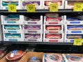 The fresh cheese aisle of a Sams Club Wholesale grocery store with a variety of fresh cheeses ready to be purchased by consumers