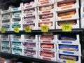 The fresh cheese aisle of a Sams Club Wholesale grocery store with a variety of fresh cheeses ready to be purchased by consumers