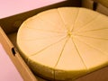 Fresh cheesecake in opened paper box, close up. Royalty Free Stock Photo