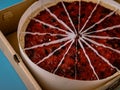 Fresh cheesecake in opened paper box, close up. Royalty Free Stock Photo