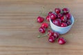 Fresh cherries in and around a white bowl Royalty Free Stock Photo