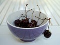 Fresh cherries in the bowl on the table Royalty Free Stock Photo
