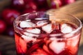 Fresh cherries ice cubes and cherry juice on wood Royalty Free Stock Photo