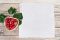 Fresh cherries and red ripe strawberries on a white plate Royalty Free Stock Photo