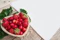 Fresh cherries and red ripe strawberries on a white plate Royalty Free Stock Photo