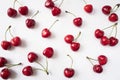 Fresh cherries scattered on white. Cherries on a white background. Cherry fruit. Creative fresh cherry pattern background with cop
