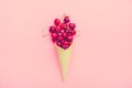 Fresh cherries in waffle cones Ice cream cone filled with fresh sweet cherry on lilac background. Top view. Copy space. Summer Royalty Free Stock Photo