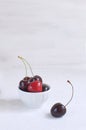 Fresh cherries in white porcelain bowl Weight loss Healthy eating Summer fruit and berries concept Harvesting Royalty Free Stock Photo