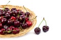Fresh cherries on a wicker plate. Royalty Free Stock Photo