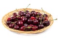 Fresh cherries on a wicker plate. Royalty Free Stock Photo