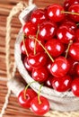 Fresh cherries in a wood bucket Royalty Free Stock Photo