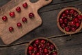 Fresh cherries on a wooden board with wooden board background on a wooden table Royalty Free Stock Photo