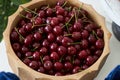 Fresh cherries in wooden bowl on table, close-up. Red cherry berries Royalty Free Stock Photo