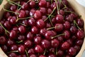 Fresh cherries in wooden bowl on table, close-up. Red cherry berries Royalty Free Stock Photo