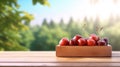 Fresh cherries in wooden crate on table and blurred organic farm on the background, mock up product display wooden board. Royalty Free Stock Photo