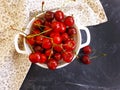 Fresh cherry berries in a plate on the background Royalty Free Stock Photo