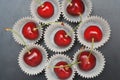 Fresh Cherry Fruit Health Vitamine in Cooking Bakery Cupcake Paper. Black Background Copy Space. Royalty Free Stock Photo