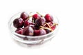 Fresh cherry fruits in glass bowl isolated on white background. Antioxidant, natural, vitamin, organic, vegetarian food berry. Royalty Free Stock Photo