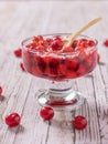 Fresh cherry jam in a vase with a wooden spoon. Royalty Free Stock Photo