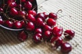 Fresh cherry on plate on towel background. fresh ripe cherries. sweet cherries