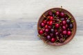 Fresh cherry on plate on wooden grey background. fresh ripe cherries. sweet cherries. Sweet cherries bowl . Royalty Free Stock Photo