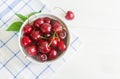 Fresh cherry on plate on wooden white background. fresh ripe cherries. sweet cherries Royalty Free Stock Photo