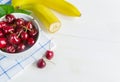 Fresh cherry on plate on wooden white background. fresh ripe cherries. sweet cherries Royalty Free Stock Photo