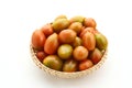 Fresh cherry tomatoes in the bamboo basket isolated on white background. Royalty Free Stock Photo
