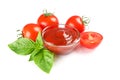 Fresh cherry tomatoes with basil and souce isolated on white background Royalty Free Stock Photo