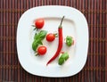 Fresh cherry tomatoes and chili on white. Royalty Free Stock Photo