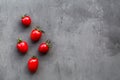 Fresh cherry tomatoes on a gray concrete background, top view, flat lay, mockup, overhead, copy space. Healthy food concept. Ripe Royalty Free Stock Photo