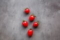 Fresh cherry tomatoes on a gray concrete background, top view, flat lay, mockup, overhead, copy space. Healthy food concept. Ripe Royalty Free Stock Photo