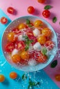 Fresh Cherry Tomatoes and Mozzarella Cheese Splashing in Water on Blue and Pink Background Royalty Free Stock Photo