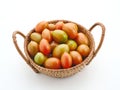 Fresh cherry tomatoes in the rattan basket isolated on white background. Royalty Free Stock Photo