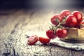 Fresh cherry tomatoes. Ripe tomatoes on oak wooden background