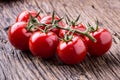 Fresh cherry tomatoes. Ripe tomatoes on oak wooden background