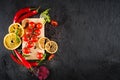 Fresh cherry tomatoes and spices on black background. Top view. Copy space Royalty Free Stock Photo