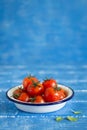 Fresh cherry tomatoes in a vintage enameled plate