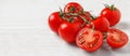 Fresh cherry tomatoes on white table, space for text. Banner design Royalty Free Stock Photo