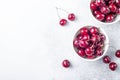 Fresh cherry in white mug on stone table Close-up Water drops Top view Copy space Royalty Free Stock Photo