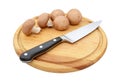 Fresh chestnut mushrooms with sharp knife on a wooden board