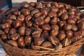 Fresh chestnuts in the brown basket Royalty Free Stock Photo