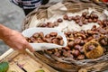 Fresh chestnuts in Ortigia fresh food street market. Syracuse, Sicily, Italy