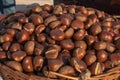 Fresh chestnuts in the wooden basket Royalty Free Stock Photo