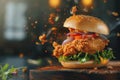 fresh chicken burger sandwich with flying ingredients and spices, Macro Royalty Free Stock Photo