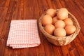 Fresh chicken eggs in the basket next to vintage tablecloth Royalty Free Stock Photo