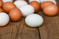 Fresh Chicken eggs and duck eggs on wooden background - white and brown egg Royalty Free Stock Photo