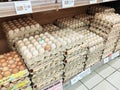 Fresh chicken eggs in a pallet container, for sale in a supermarket. Sort by grade and size.